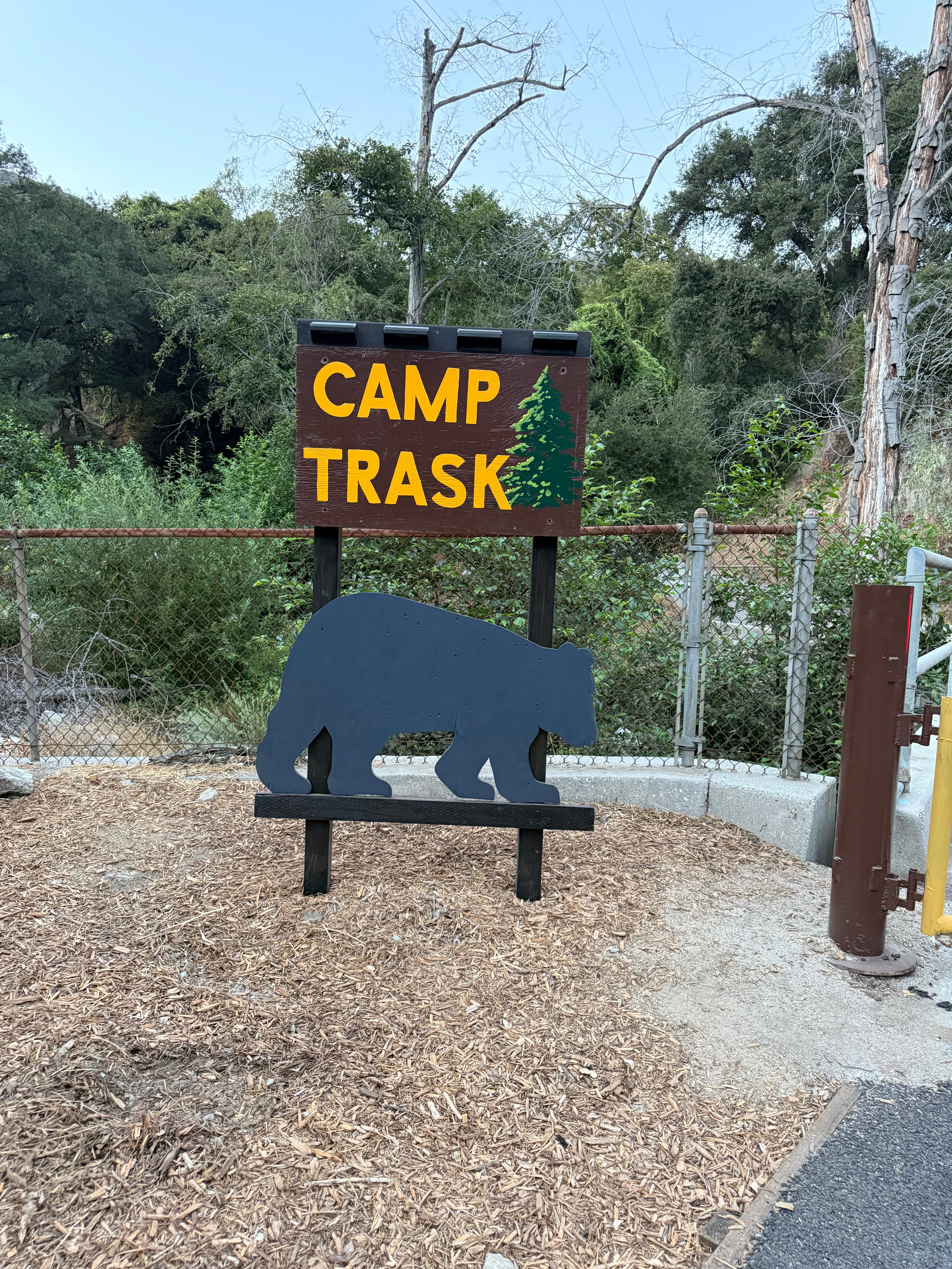 Camp Trask entrance sign with the camp bear